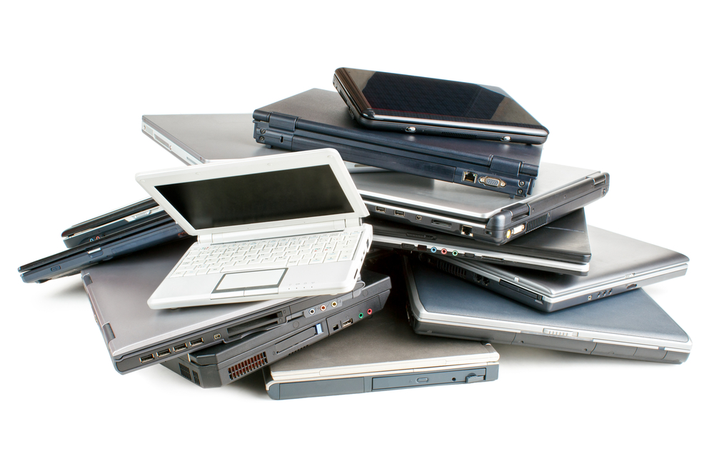 stack of used laptops