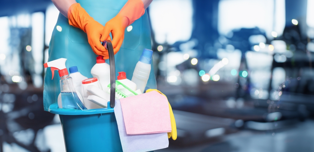 a person with cleaning products.