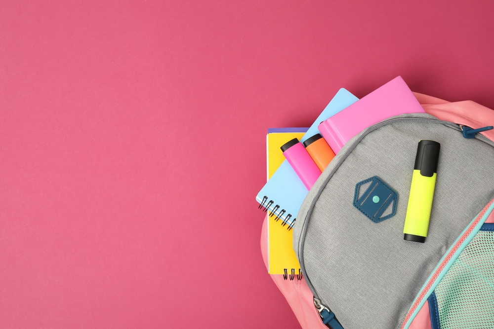 school bag with notebooks and pencils.