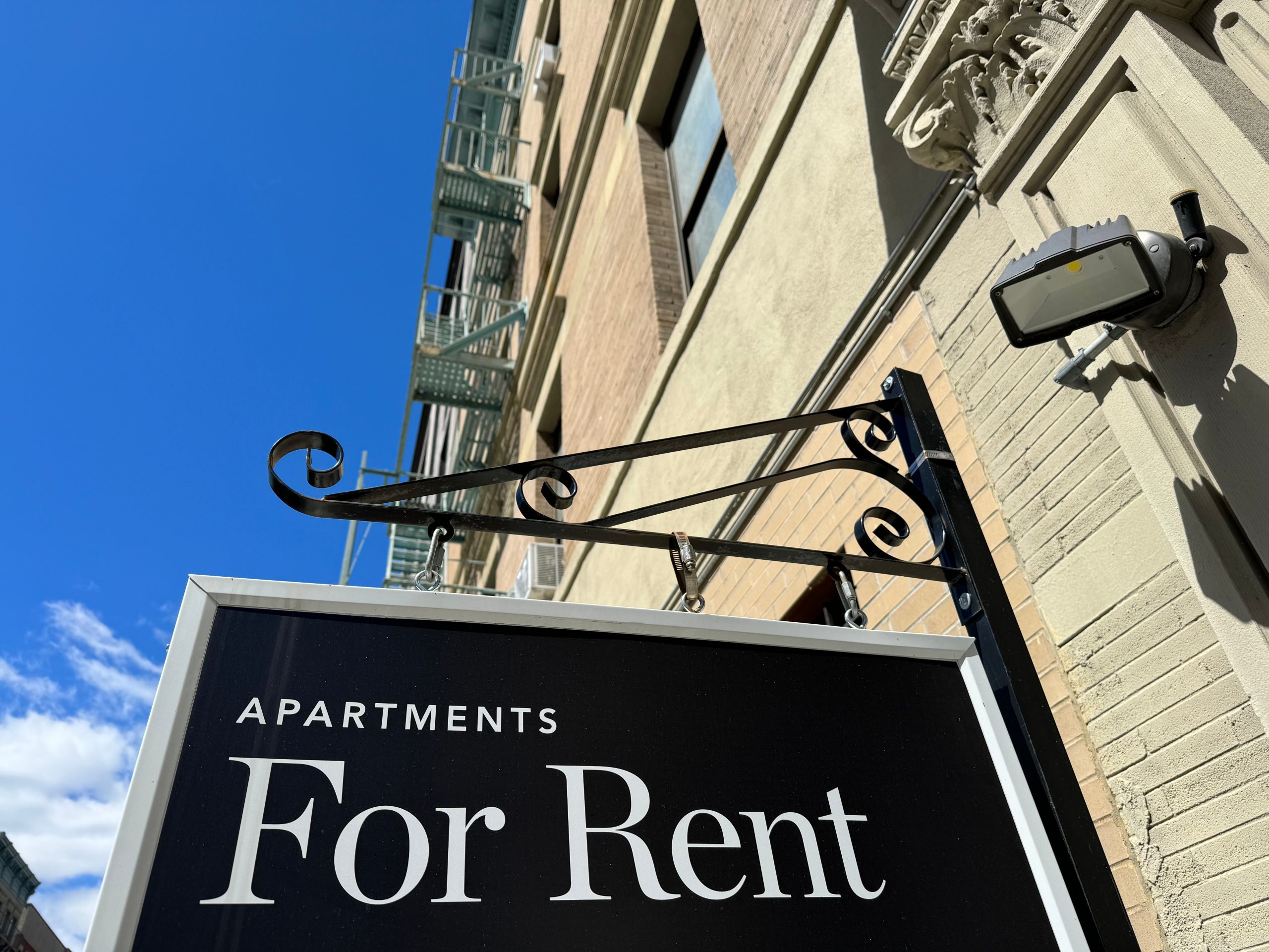 chalk board with an "Apartments for rent" sign 