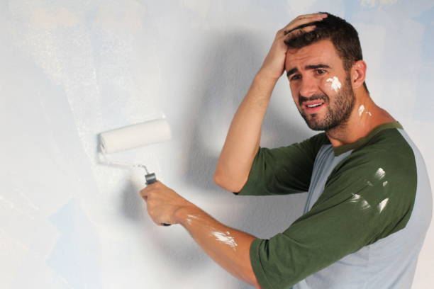 A man feeling confused about finishing his apartment.