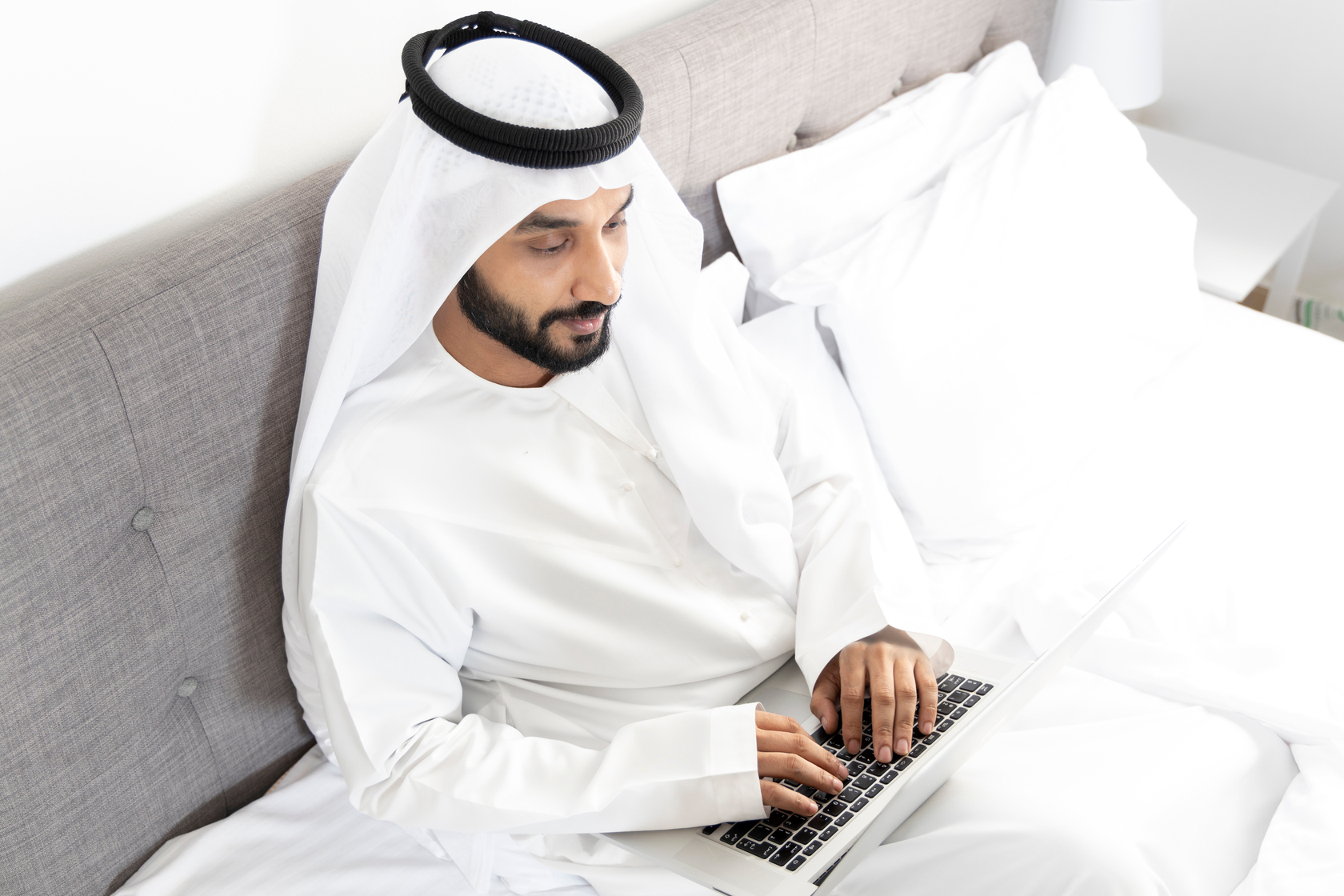 Kuwaiti man working from home.